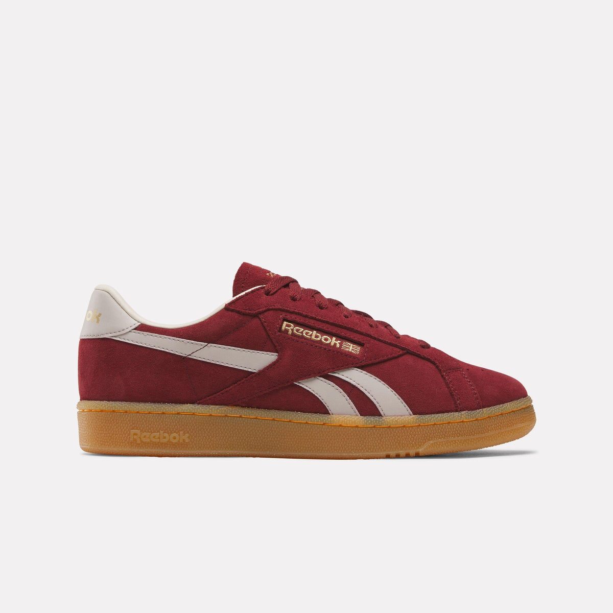 Burgundy sneaker with gum sole and white stripe.