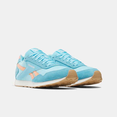Two light blue sneakers with gum soles and coral accents.