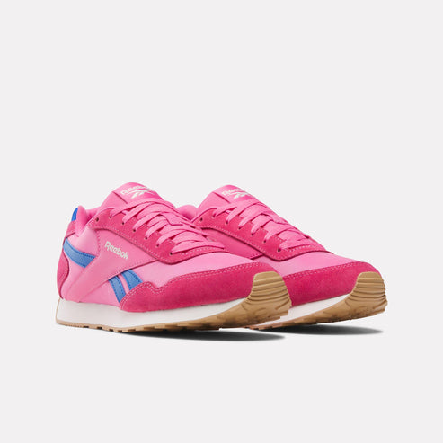Pair of pink sneakers with blue accents and gum soles.