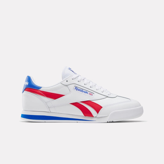 Low-top white sneaker with red stripe and blue accent.