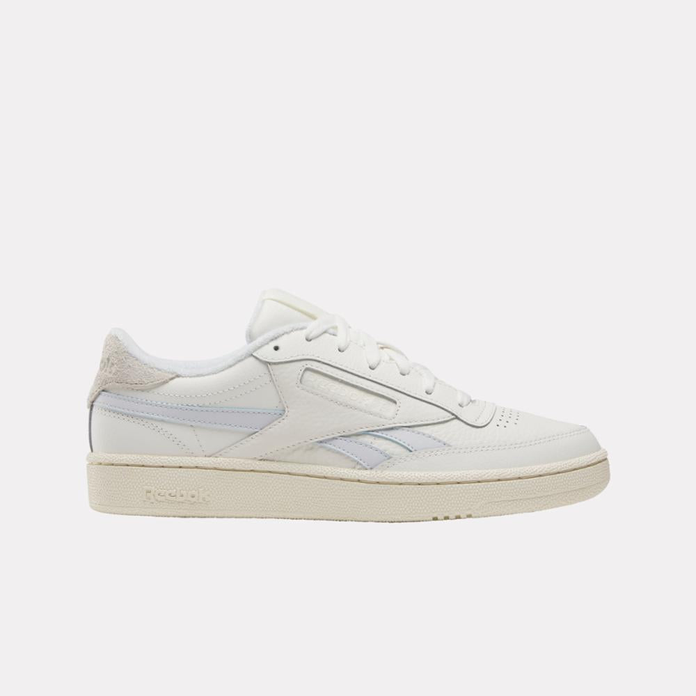 White low-top athletic shoe with a star on the side.