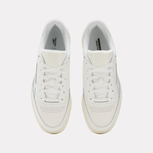 Overhead view of two off-white sneakers with laces.