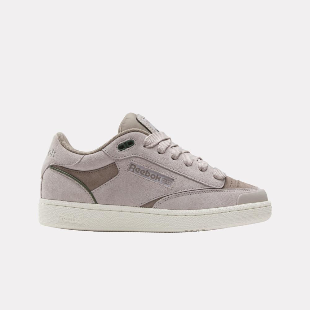 Light purple low-top shoe with “Reebok” and logo on the side.