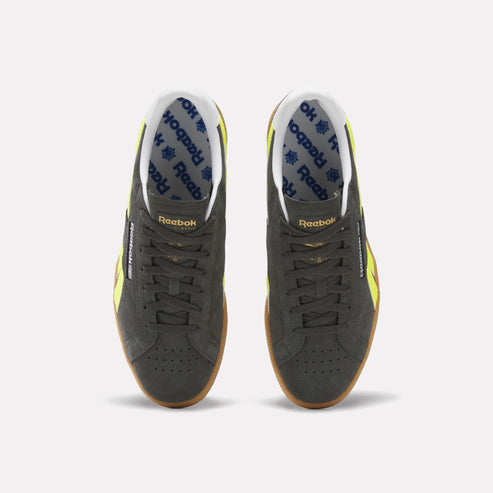 Top-down view of two dark gray sneakers with a white interior lining, blue logo pattern, yellow accents, and brown soles.