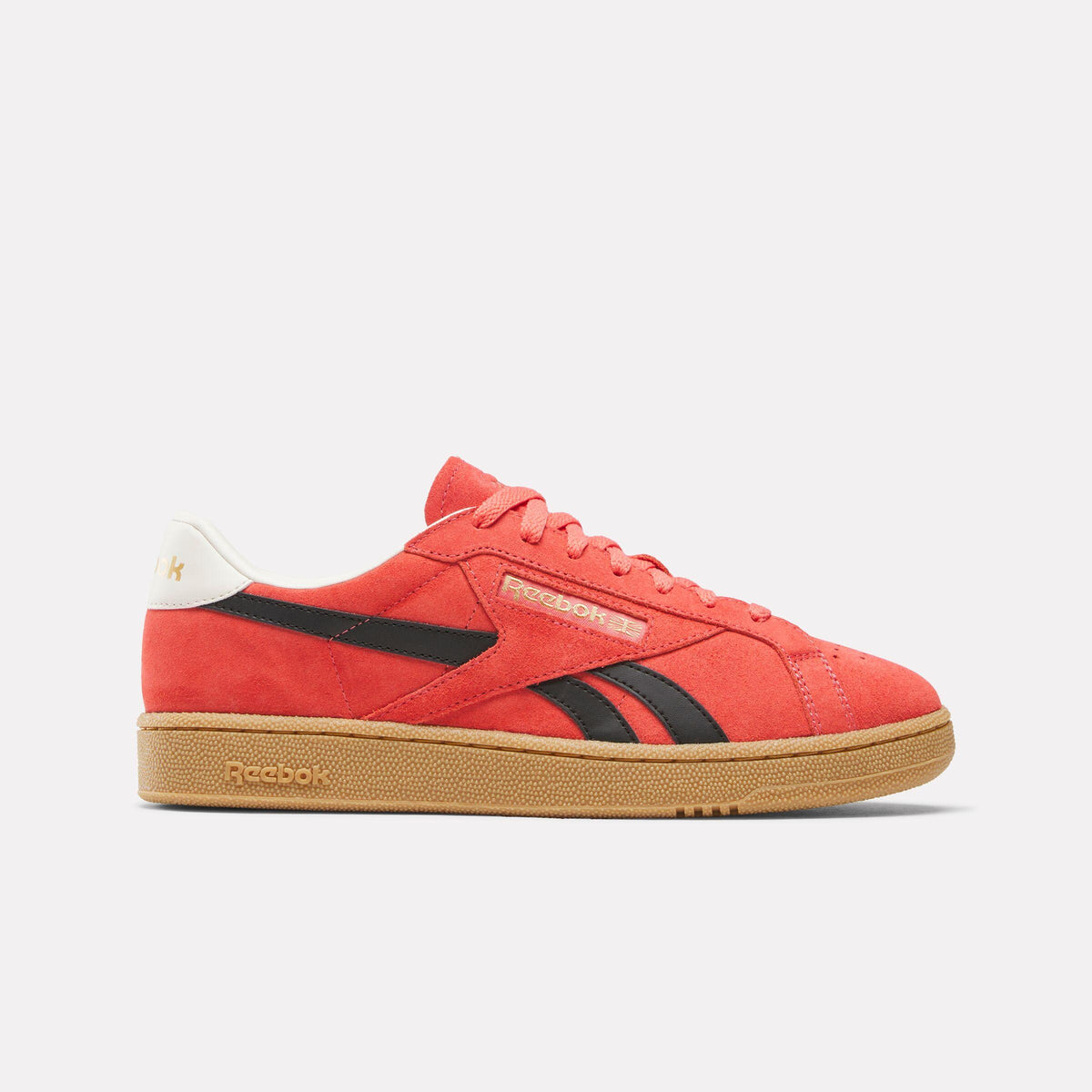 Red low-top sneaker with gum sole, black stripes, and a white heel.