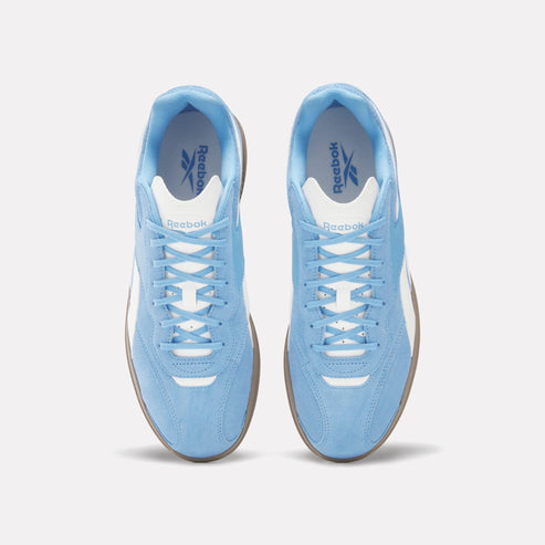 Overhead view of light blue Reebok sneakers with white trim and laces.