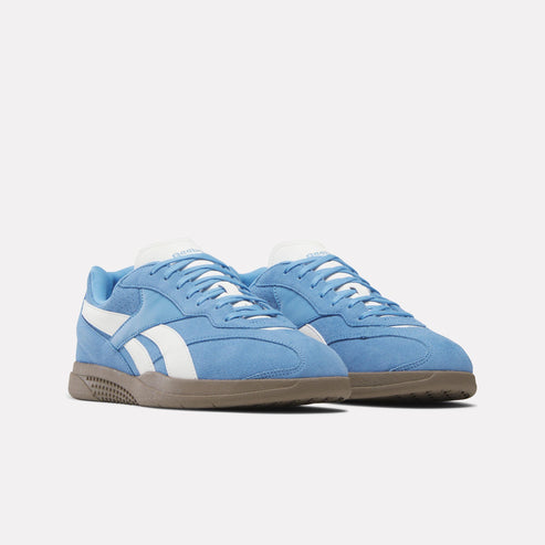 Low profile light-blue suede sneakers with white stripes and brown soles.