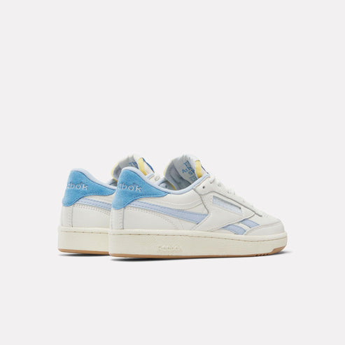 Two off-white tennis shoes with light-blue accents.