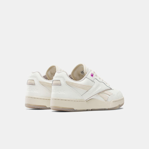 Low top off-white leather shoes.