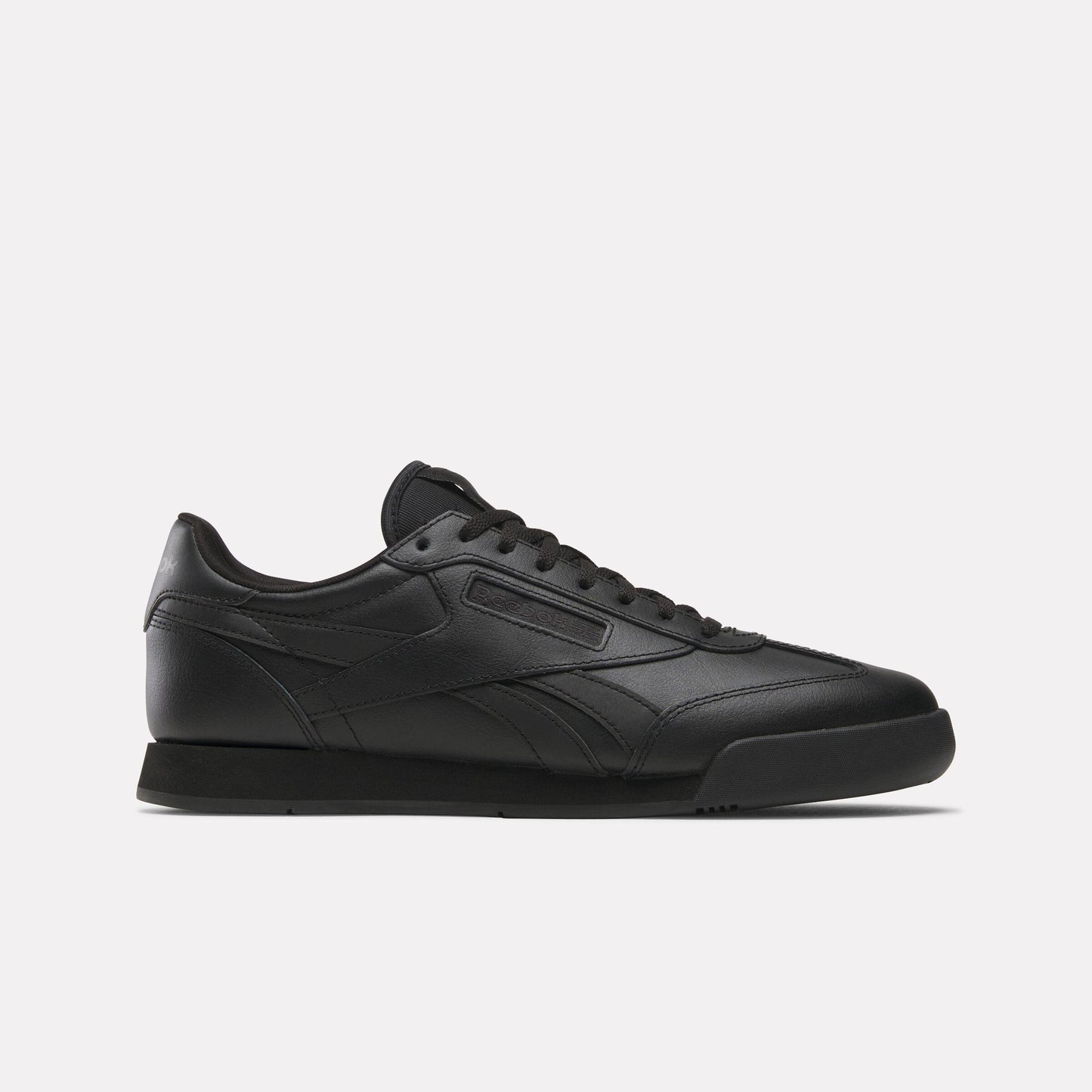 Black leather sneaker with a low profile, featuring a tonal sole and lace-up closure.