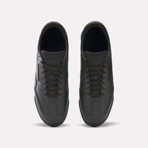 Top-down view of black leather sneakers with lace-up closure.
