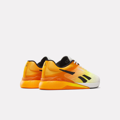 Pair of athletic shoes with vibrant yellow and orange gradient, black vector logo, and white sole.