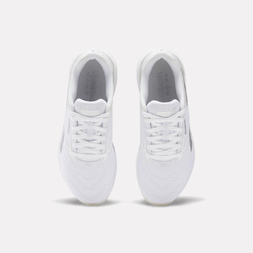 Pair of white athletic shoes, top view.