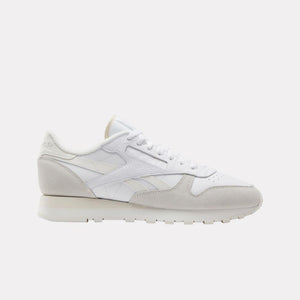 A low-rise, all-white sneaker.
