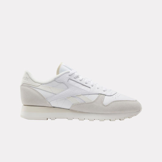 A low-rise, all-white sneaker.
