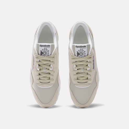 Top view of beige low-rise sneaker with white laces.