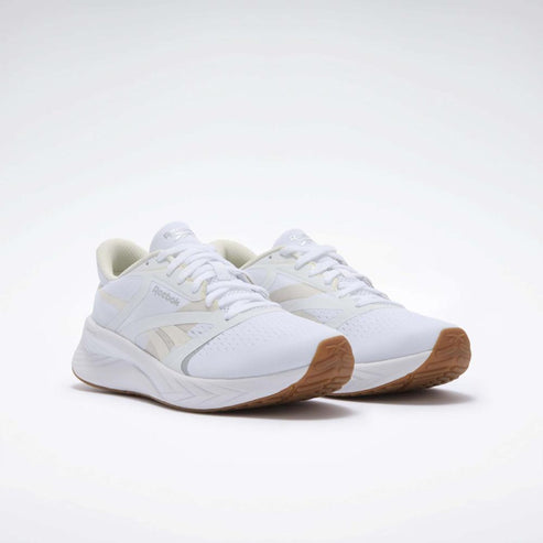 Pair of white sneakers with gum soles and white laces.