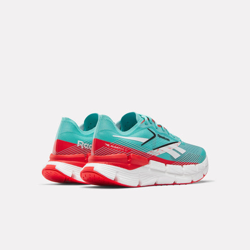 Teal and red running shoes with the word "Reebok" and logo visible.