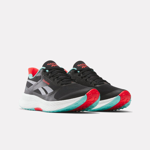 Low-top running shoes featuring black upper, a white midsole, and a sole with red and aqua blue accents.