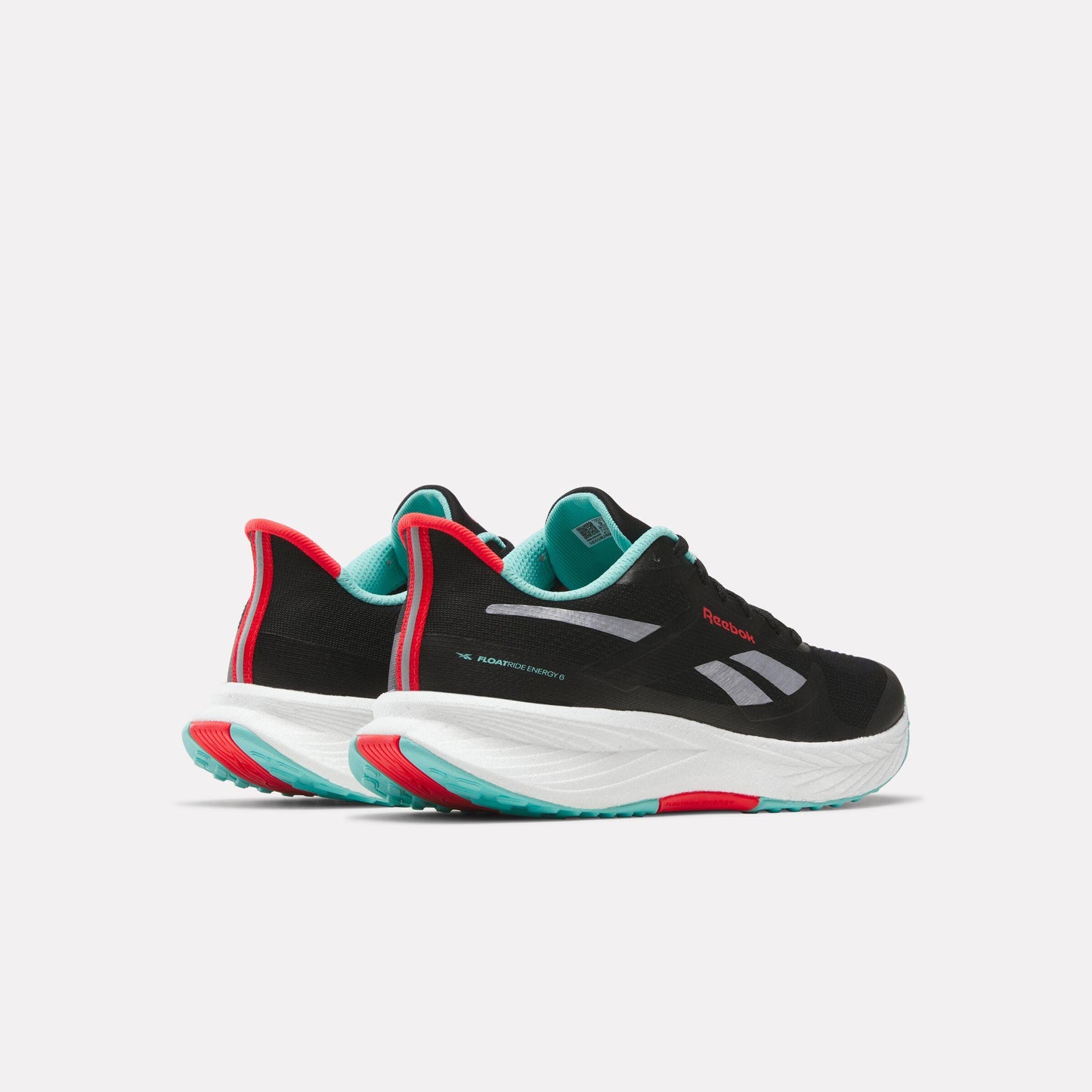 Pair of black sneakers with red and teal accents and white soles.