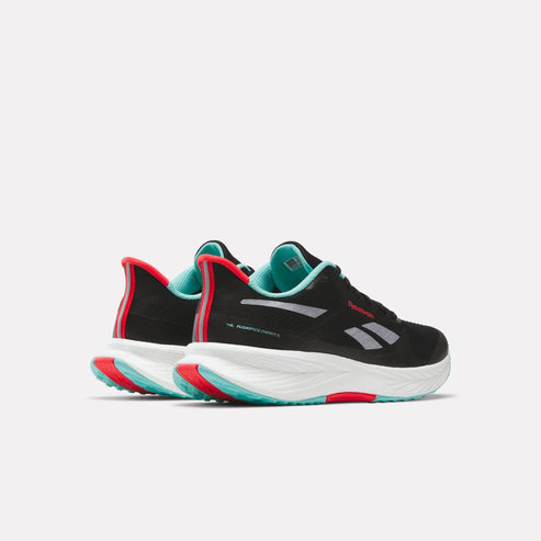 Pair of black sneakers with red and teal accents and white soles.