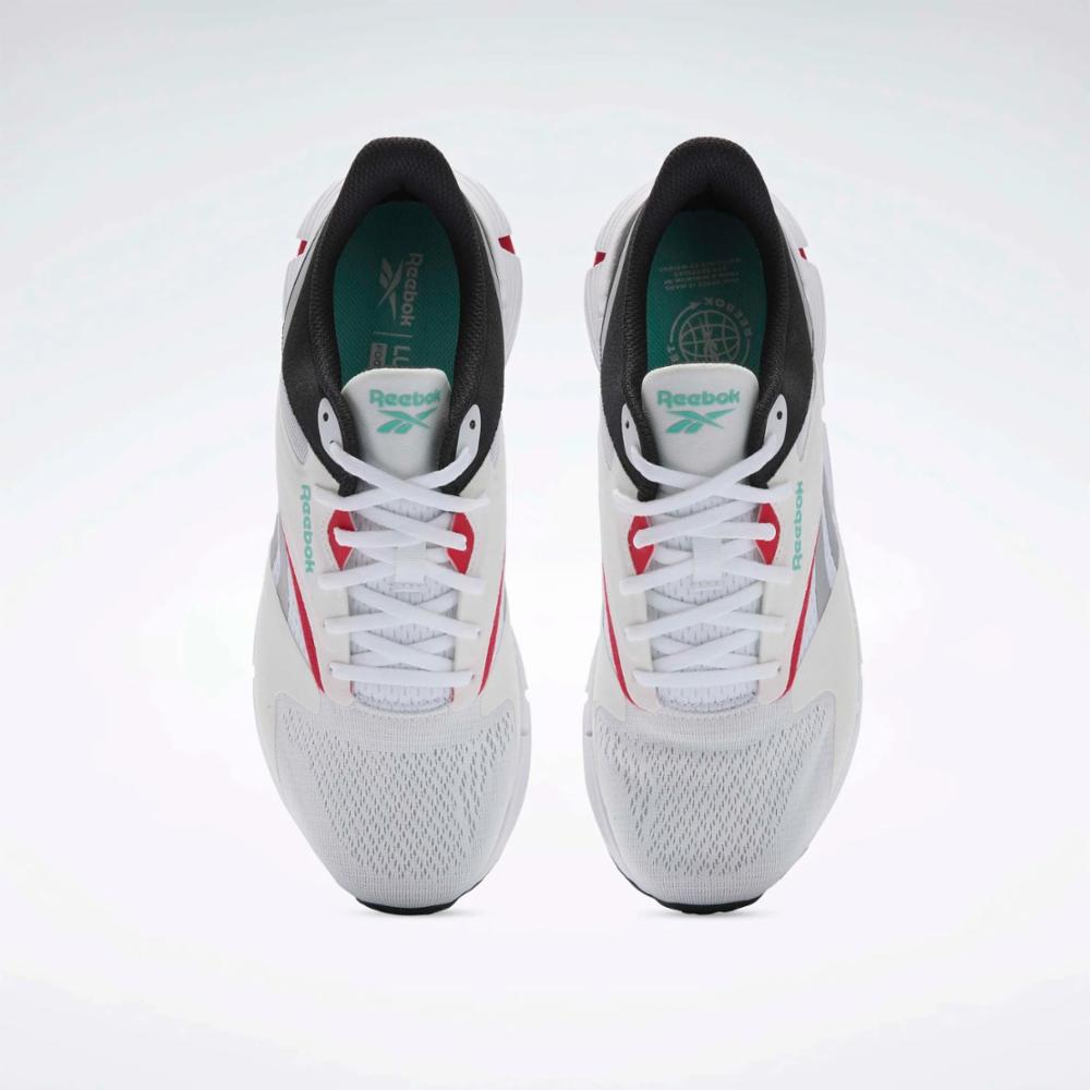 A pair of white athletic shoes with black and red accents, seen from the top.