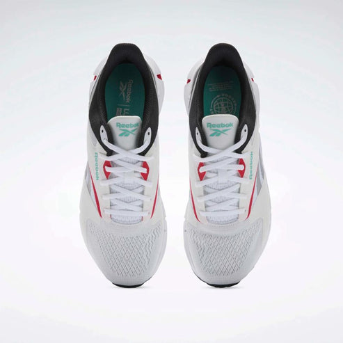 A pair of white athletic shoes with black and red accents, seen from the top.