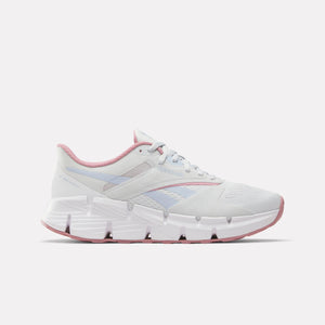 White athletic shoe with pink trim and visible geometric sole.
