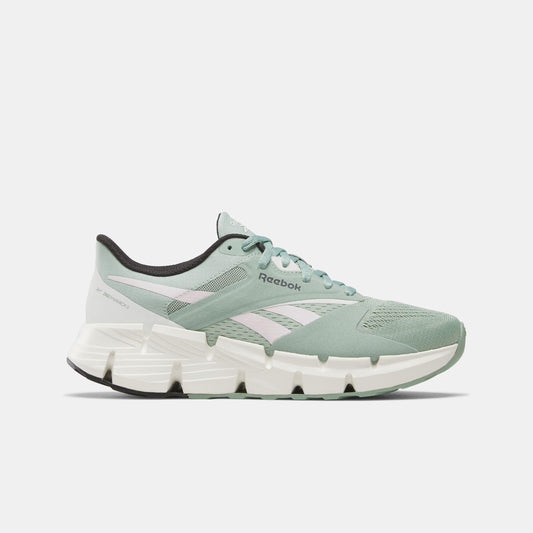 Light green running shoe with white accents and a black sole.