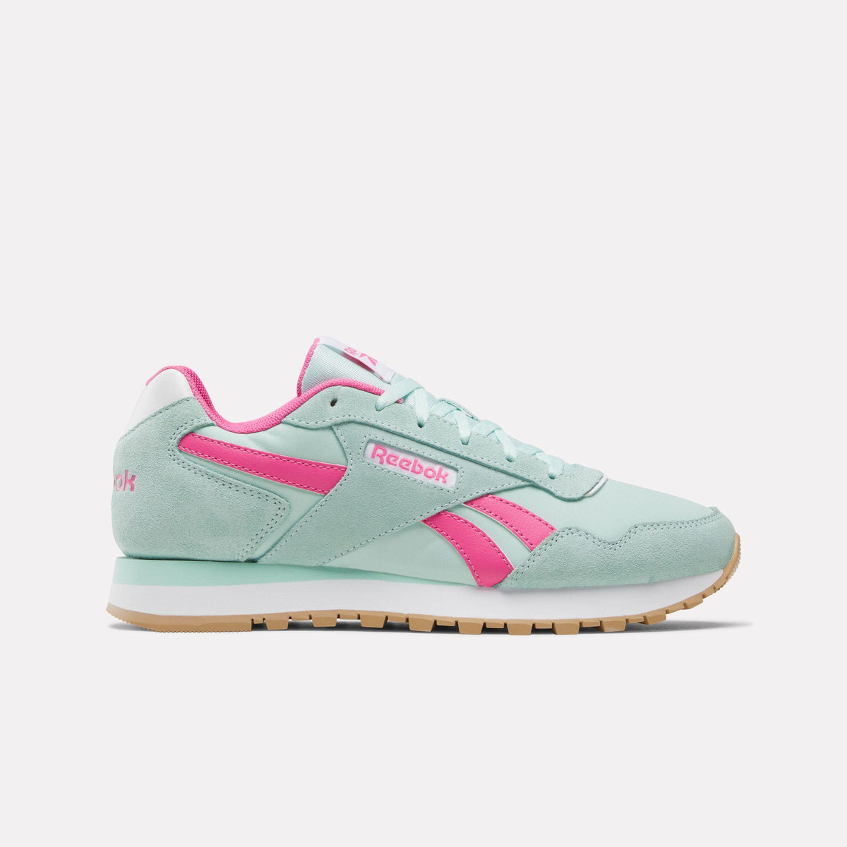 Mint green sneaker with pink accents and a gum sole.