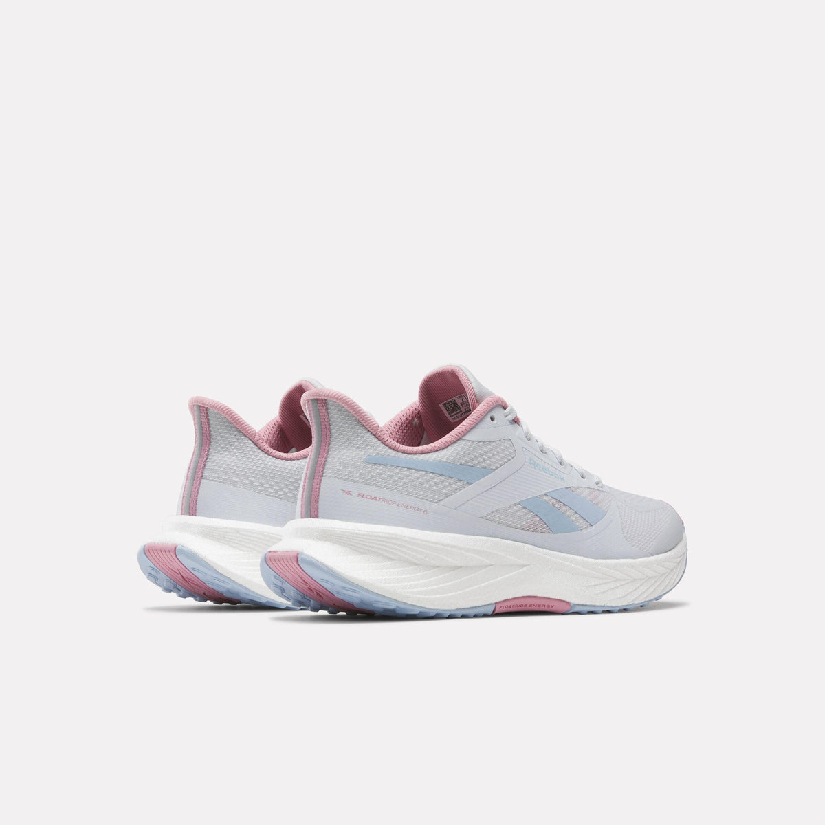 Pair of running shoes in light blue with pink accent, showing the back view.