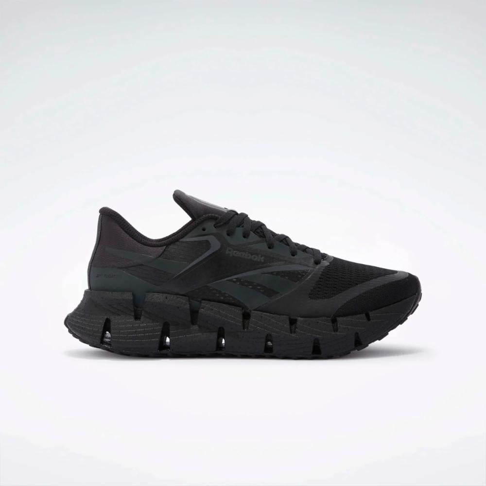 Black running shoe with zigzag sole.
