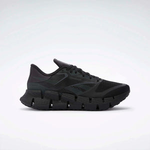 Black running shoe with zigzag sole.