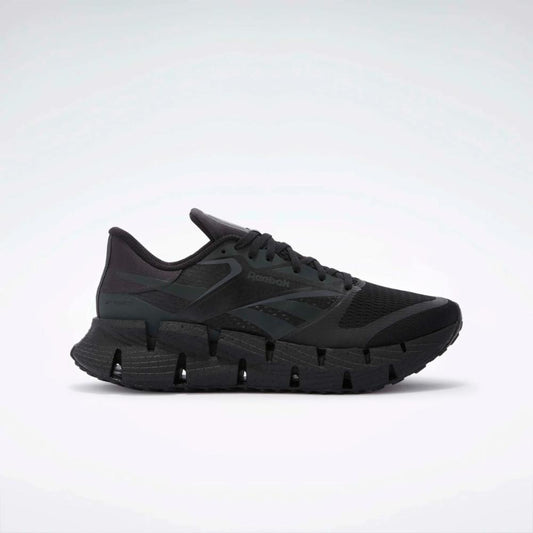 Black running shoe with zigzag sole.