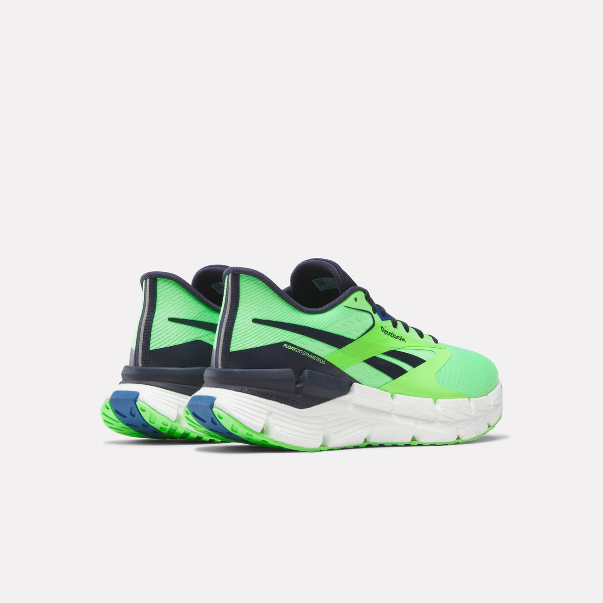 Back view of bright-green athletic shoe with navy accents and a white jagged sole.