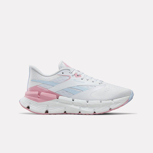 A white running shoe with a thick midsole and pink and blue accents.