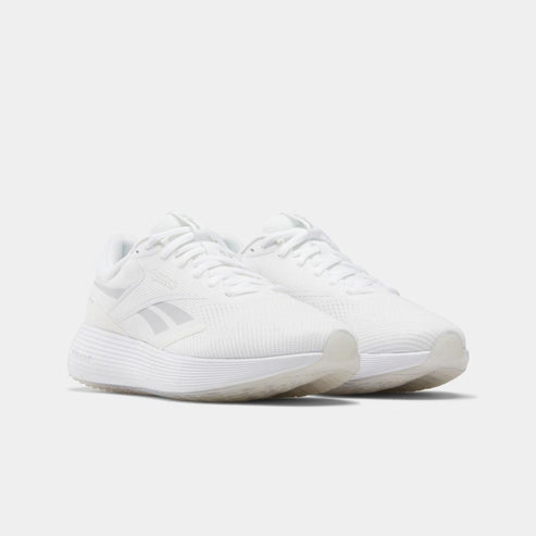 Pair of white running shoes with white laces and transparent soles.