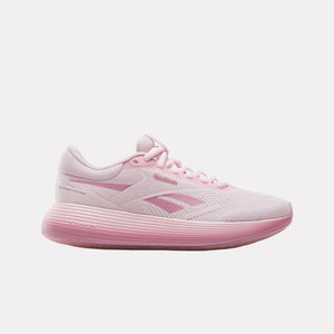 Pink athletic shoe with text "Reebok" on the side.