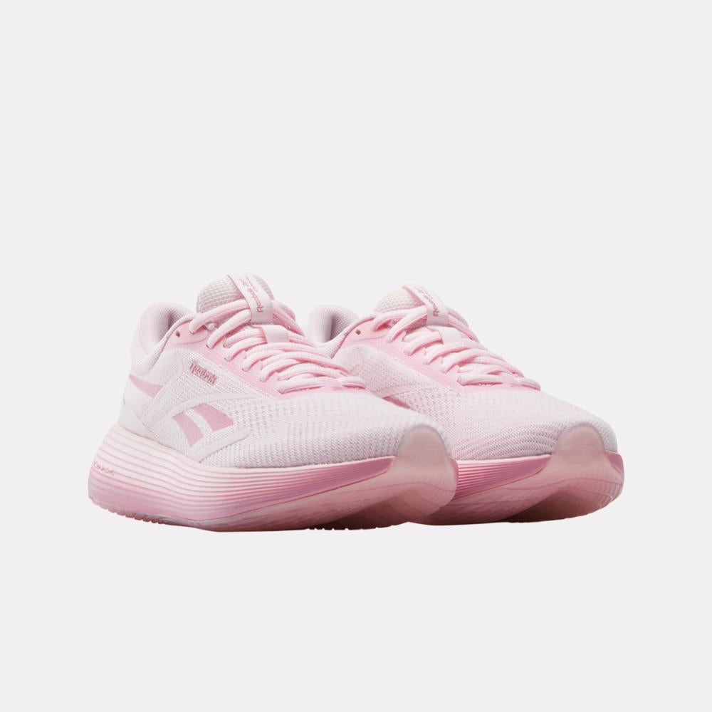Pair of light pink running shoes with light pink laces and logo.