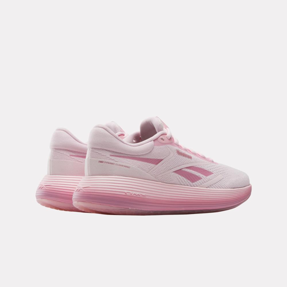 Pair of pink low-top athletic shoes with a textured sole and side stripe.