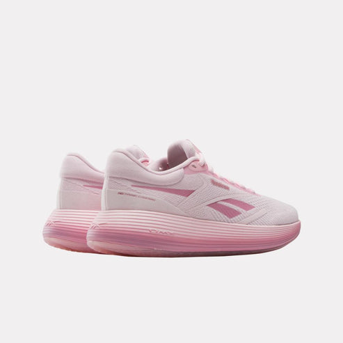 Pair of pink low-top athletic shoes with a textured sole and side stripe.