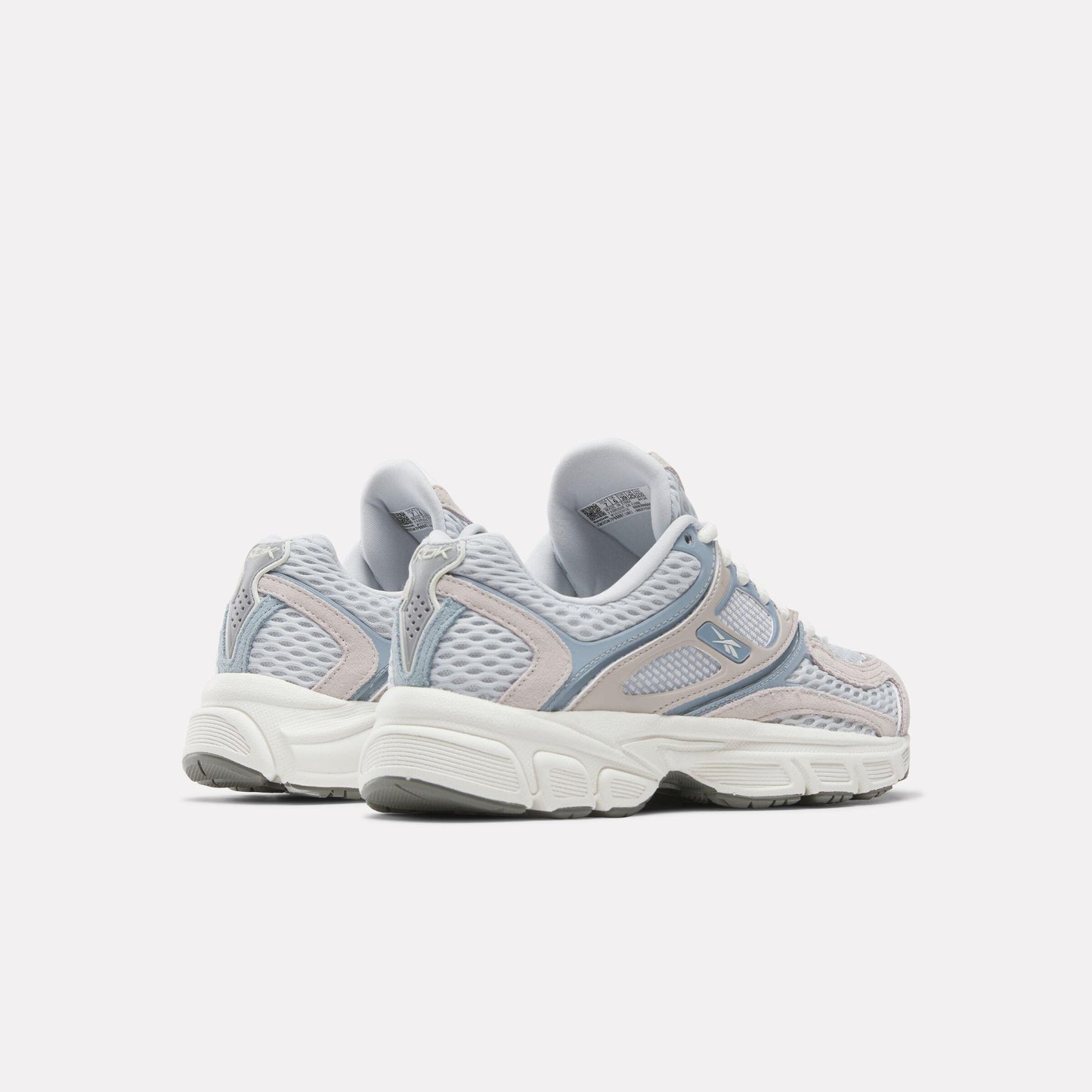 Pair of low-top athletic shoes featuring light grey mesh, white soles, and light blue accents.
