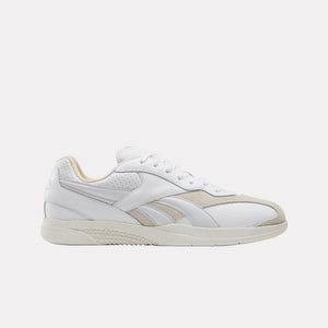 White low-top sneaker with beige accents, perforated details, and off-white sole.