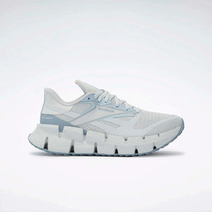 White running shoe with a zigzag patterned sole.