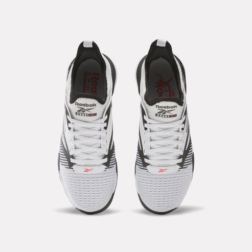 Pair of white, black, and red running shoes with a lace-up closure. Visible text: "Reebok" and "NANO X3".