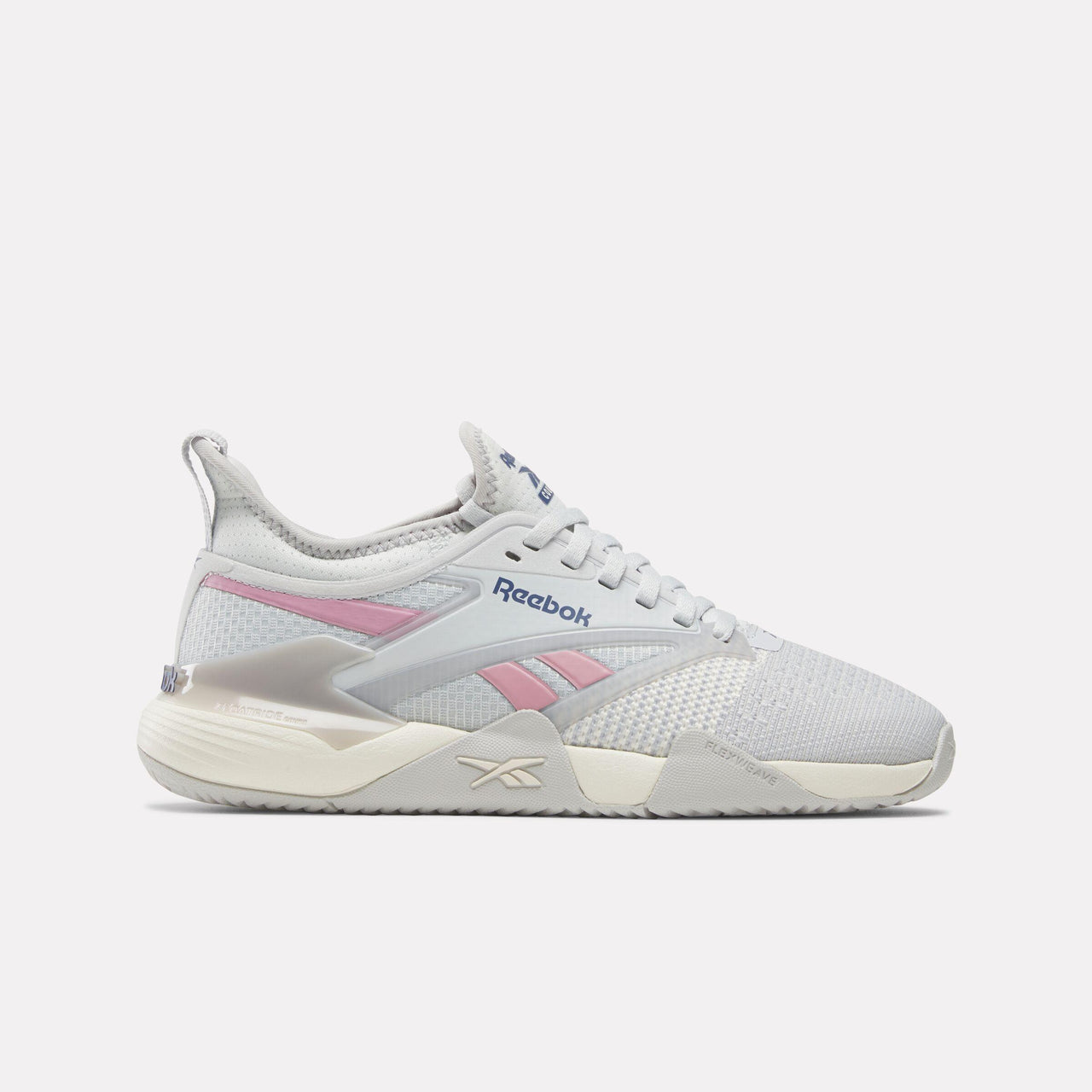 Light grey training shoe with pink accents and 'Reebok' printed on the side.
