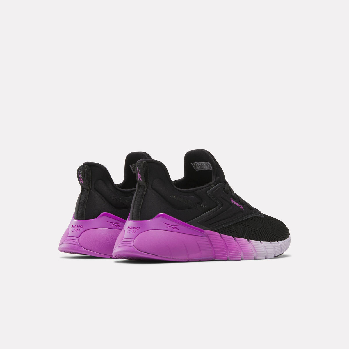 Pair of kids' black and purple sneakers, rear view.