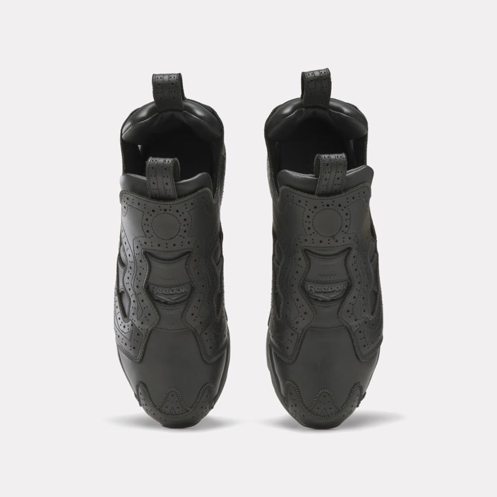 Pair of low-rise, all black, shoes viewed from the front.