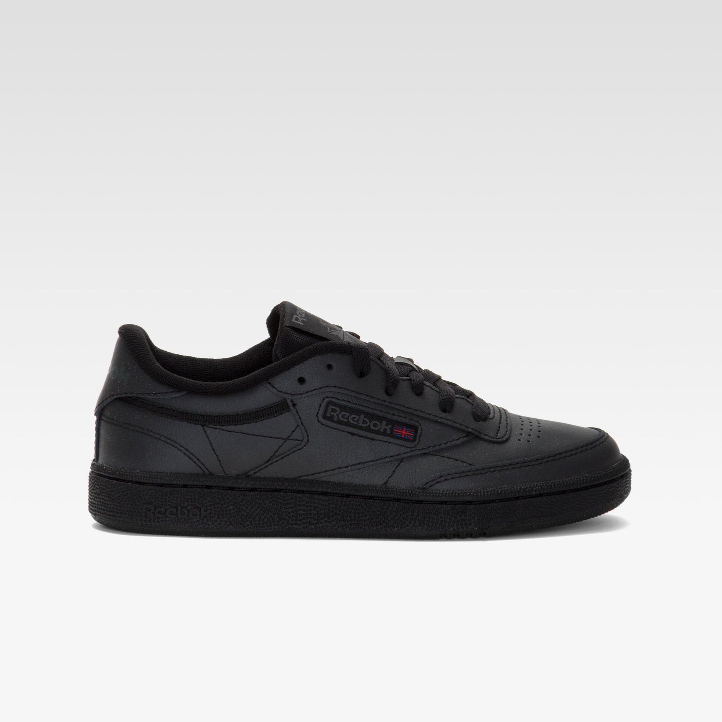 Black low-top sneaker with side logo.