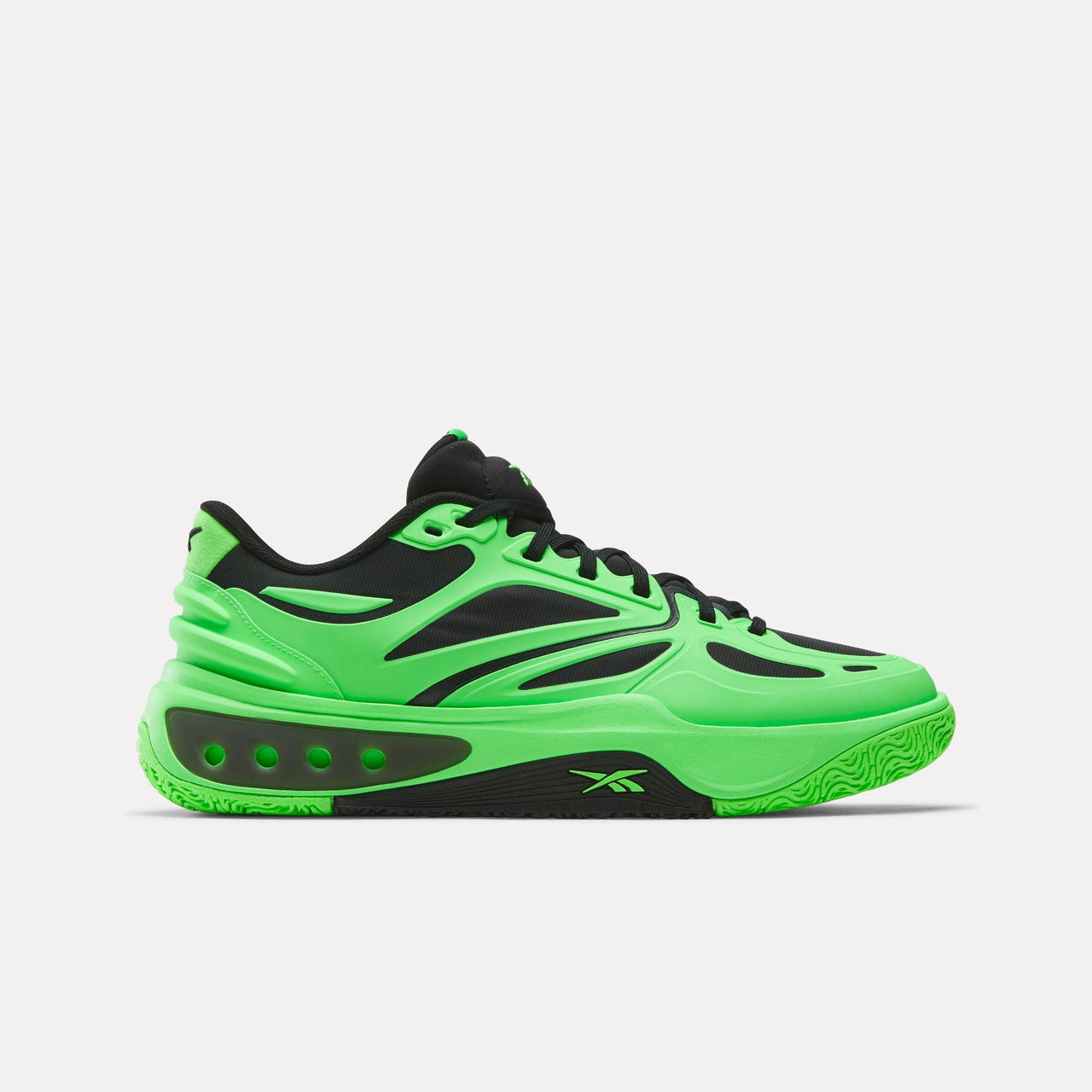 Low-top athletic shoe, green with black accents and black laces.